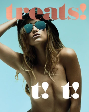 Model wearing aviator sunglasses and a dark cap against a solid blue background for Treats magazine cover.