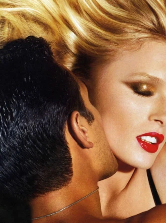 Close-up portrait of a blonde woman with red lipstick and dark eye makeup alongside a man with dark hair in Los Angeles.