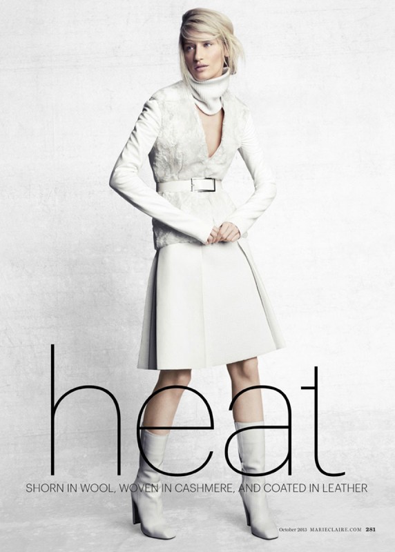 Fashion editorial image featuring a female model in an all-white outfit with a skirt, jacket, and boots against a white background.