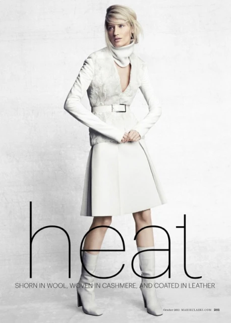 Fashion editorial image featuring a female model in an all-white outfit with a skirt, jacket, and boots against a white background.