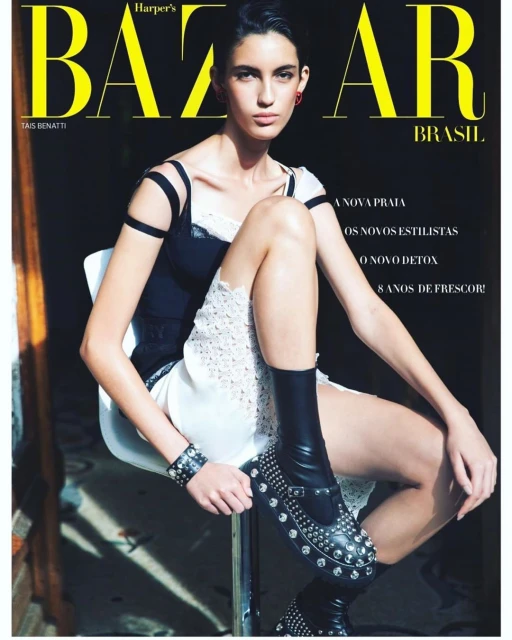 Magazine cover featuring a model in black and white fashion sitting on a stool. The cover is for Harper's Bazaar Brasil.