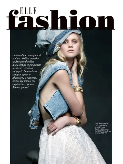 Elle Fashion magazine cover featuring a blonde woman wearing a denim hat and vest, and a white skirt, posing against a grey backdrop.