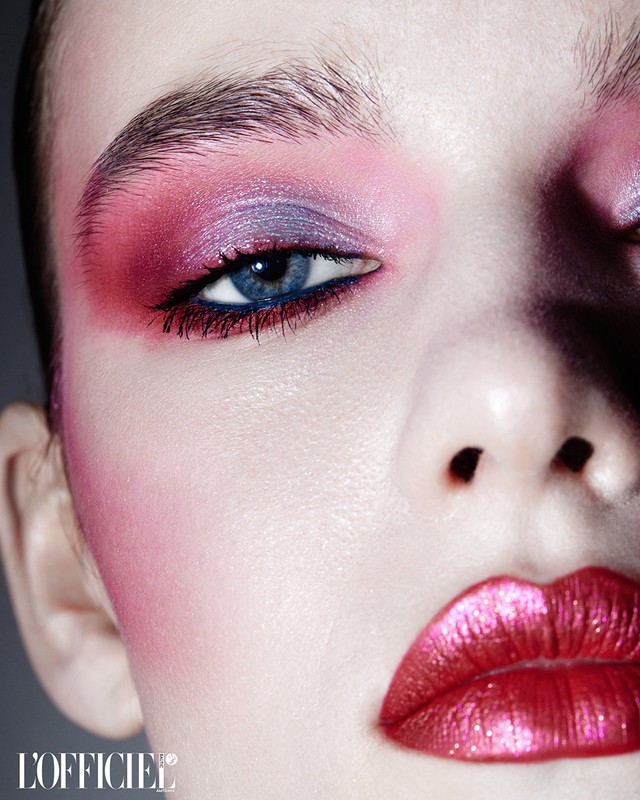 Close-up portrait of a woman with vibrant pink and purple eyeshadow and metallic pink lips by make-up artist David Razzano