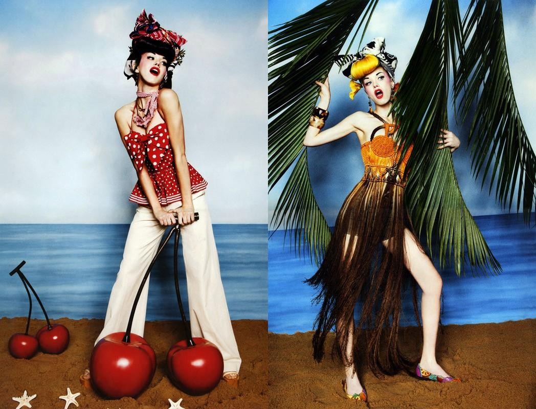 Two fashion models on a beach with cherry props, wearing colorful and patterned outfits in a split-screen studio shot.