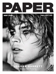 Close-up black and white portrait of Jordan Barrett with wet hair and intense gaze featured on magazine cover.