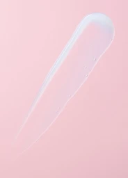 A translucent cosmetic gel smear and tiny air bubbles on a pale pink background