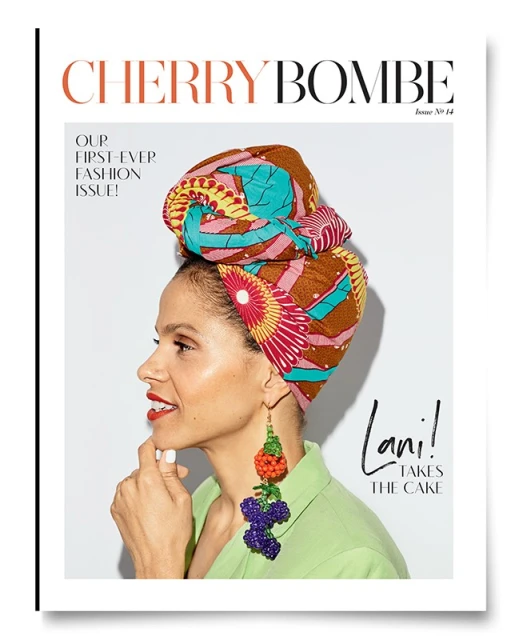 Magazine cover featuring a woman with a patterned headwrap and fruit earrings against a white background. Text reads Cherry Bombe.
