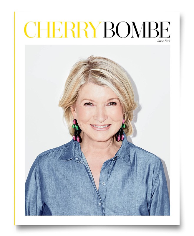 Close-up magazine cover featuring a smiling adult woman with short blond hair wearing a denim shirt against a white background.