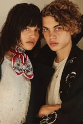Close-up portrait of two young models posed closely together, styled by Doria Santlofer in Los Angeles.