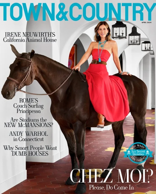 Town & Country magazine cover featuring a woman in a red dress riding a horse, with the magazine's text and headings visible in the background.