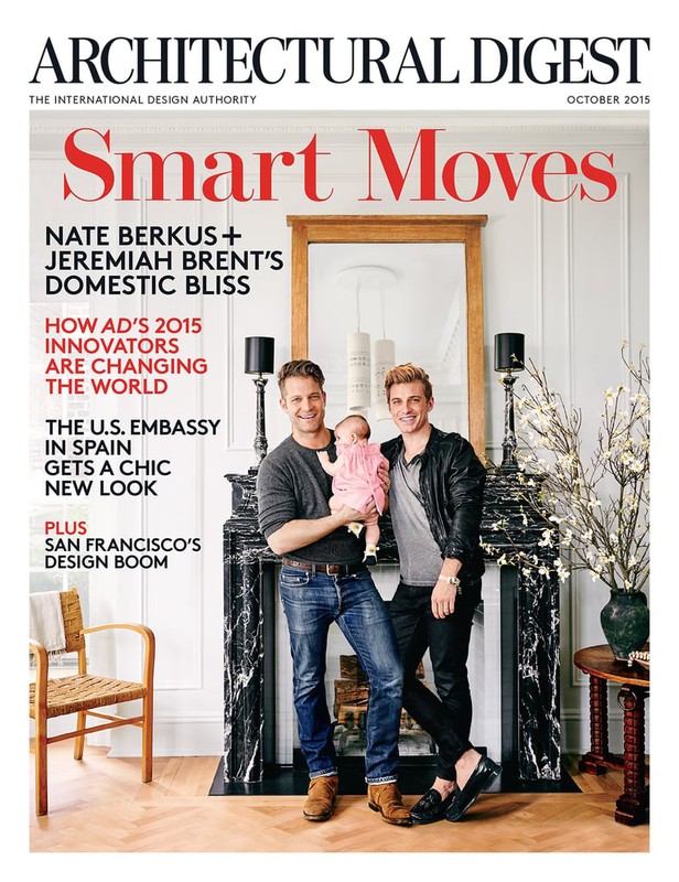 Magazine cover featuring Nate Berkus, Jeremiah Brent, and their child in an interior setting, highlighting home and family themes.