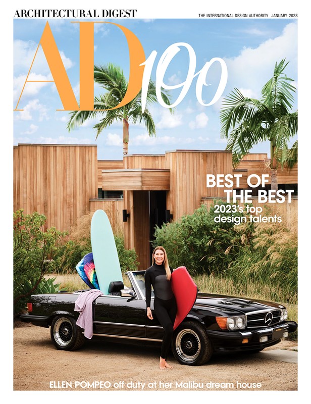 Architectural Digest cover featuring Ellen Pompeo, a black convertible, surfboards, and a modern wood house, all set against a bright blue sky.