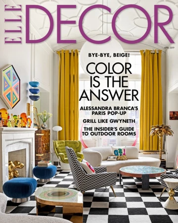 Elle Decor magazine cover showcasing a stylish living room with a black and white checkerboard floor, colorful furniture, and natural light.