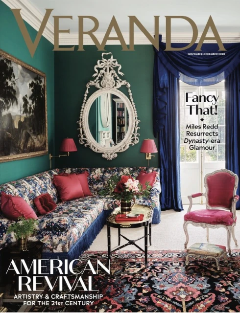 Veranda magazine cover with a lavish interior featuring a floral sofa, antique mirror, dark green walls, and elegant furniture.
