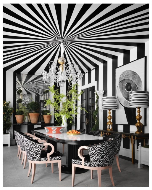 Luxurious dining room interior with black and white striped walls and ceiling, zebra print chairs, and a chandelier.