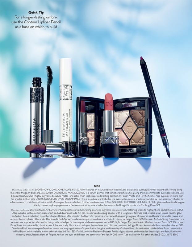 Dior makeup product display with Diorshow Iconic Overcurl Mascara, eyeshadow palette, and Contour Lipliner Pencil on a table against a blue backdrop.