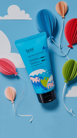 Blue cosmetic tube with water wave design surrounded by colorful paper balloons against a blue background with white paper clouds.