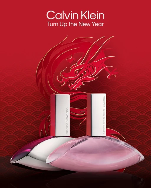 Two Calvin Klein Euphoria perfume bottles are displayed against a red backdrop with a golden dragon illustration and wave pattern.