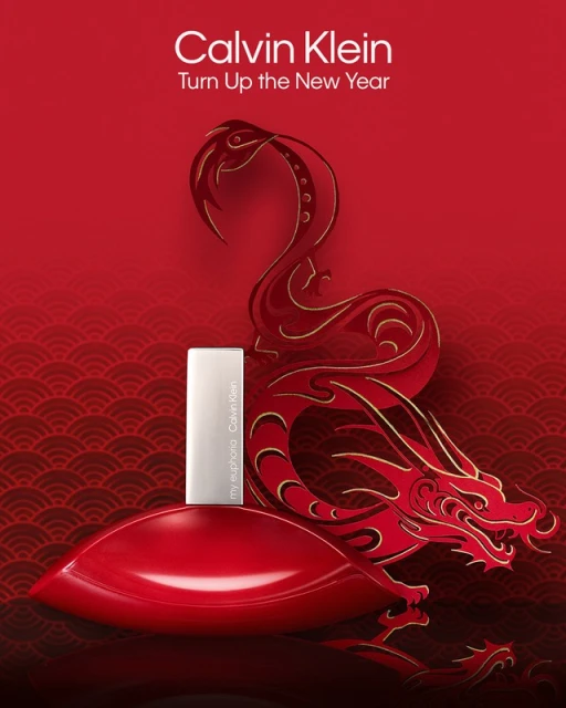 Calvin Klein's 'my euphoria' perfume bottle is showcased against a red dragon design, celebrating the New Year with elegance.