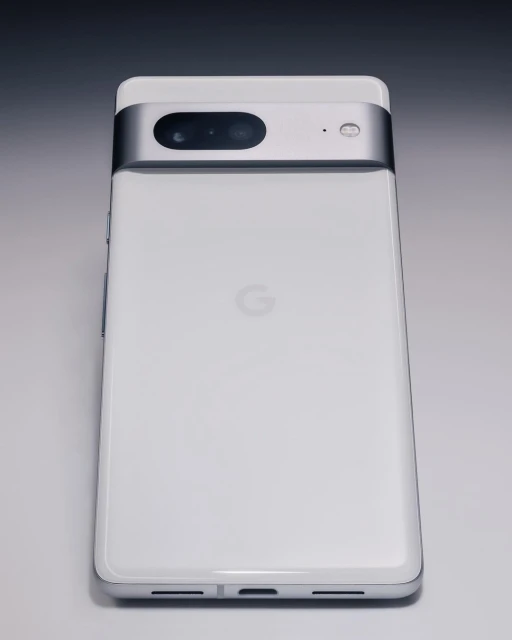 Google Pixel 7 Pro smartphone displaying its back, which features a sleek white finish with a silver metal camera bar.