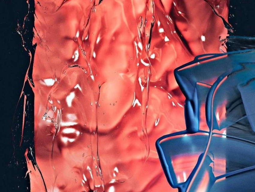Abstract still life with translucent red resin and blue plastic forms, creating a play of light and shadow on a dark background.