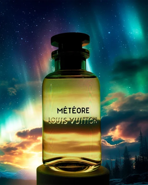 Louis Vuitton Météore fragrance bottle in front of an aurora borealis and forest scene, featuring a glass bottle with black accents.