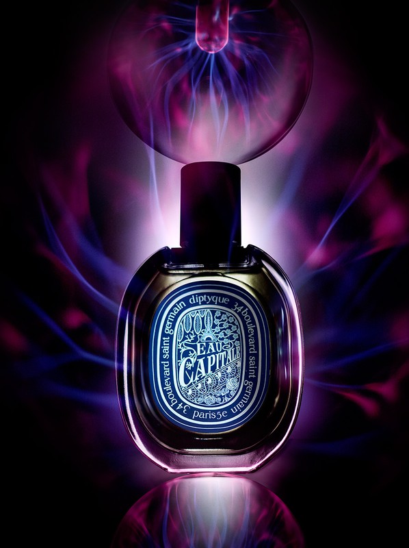 Fragrance bottle by Diptyque, Eau Capitale, illuminated with plasma globe effect, showcasing luxury beauty product and product shot.