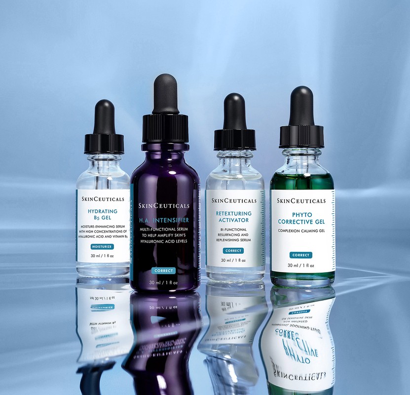 Four bottles of SkinCeuticals skincare products, including hydrating B5 gel, H.A. intensifier, retexturing activator, and phyto corrective gel.