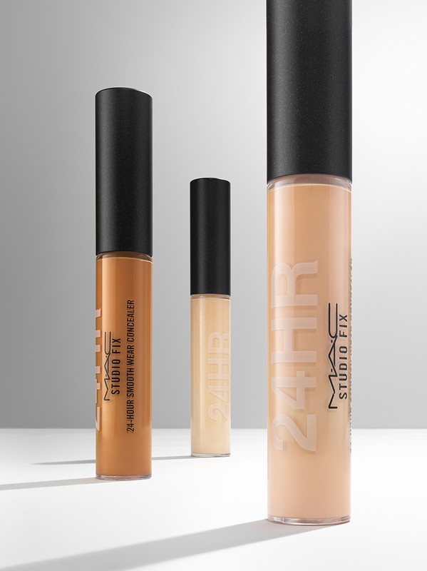Three MAC Studio Fix concealers in a product shot against a neutral background. Tones vary from light to medium. Focus on center product.
