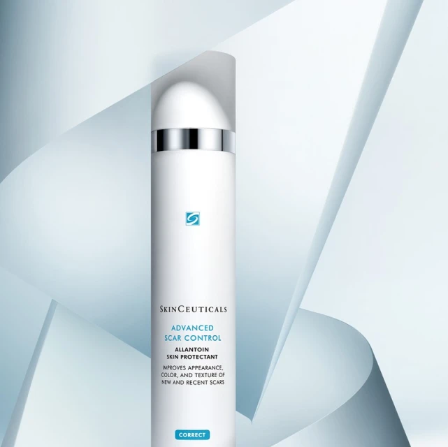 Elegant studio shot of SkinCeuticals Advanced Scar Control, an Allantoin skin protectant, against a light blue geometric backdrop.