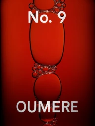 Macro view of suspended red liquid droplets forming abstract shapes with white text reading No. 9 and OUMERE.