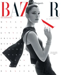 Ava Smith in Balenciaga on a magazine cover styled with sharp winged eyeliner and a high topknot