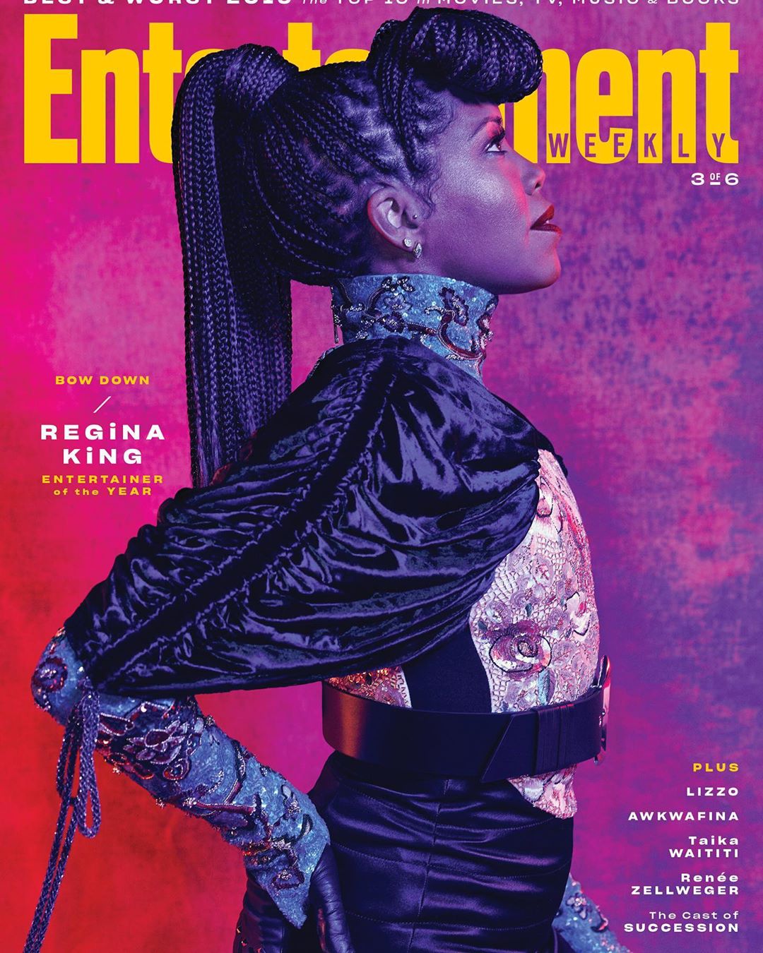Entertainment Weekly cover featuring Regina King in an embellished navy outfit with high ponytail looking up against a pink background.