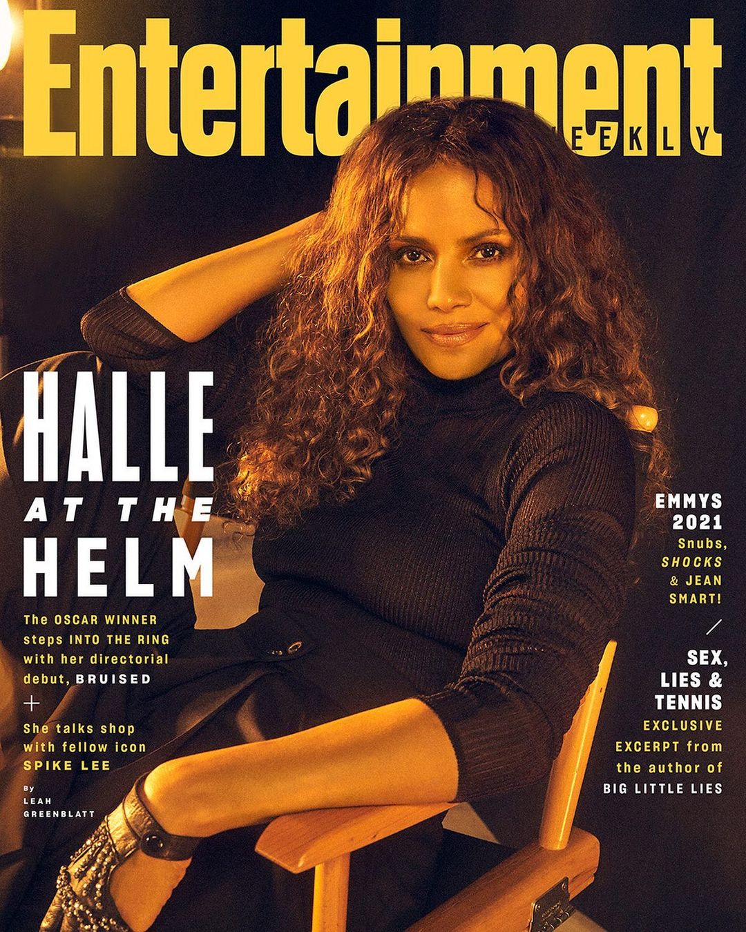 Entertainment Weekly cover featuring Halle Berry wearing a black turtleneck, sitting in a wooden director's chair, posing with her arm up.