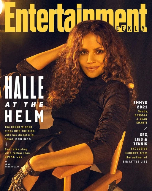 Entertainment Weekly cover featuring Halle Berry wearing a black turtleneck, sitting in a wooden director's chair, posing with her arm up.