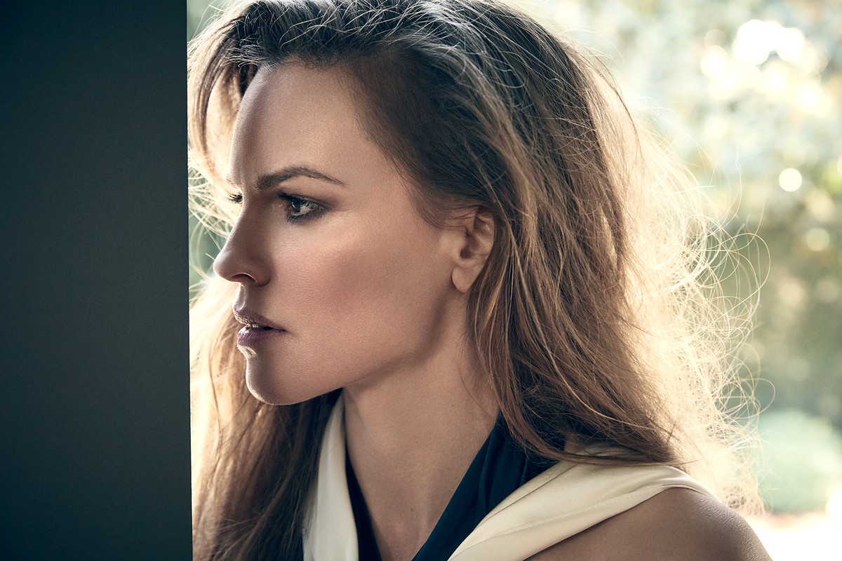 Close-up profile portrait of a woman with long hair and dark eyeliner by photographer James White