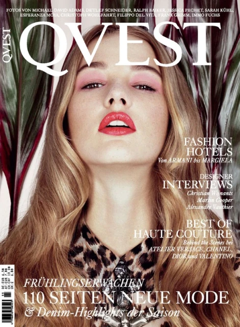 Magazine cover featuring a woman with pink eye shadow, red lipstick, and a leopard print shirt, framed by tropical foliage. The masthead reads QVEST.