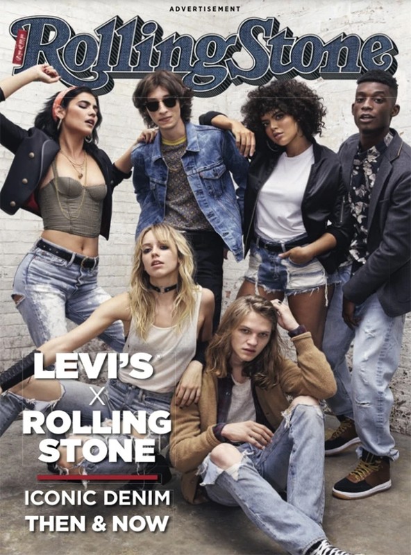 Rolling Stone cover featuring group of six diverse young adult models in denim apparel, posed in a studio setting with neutral background.