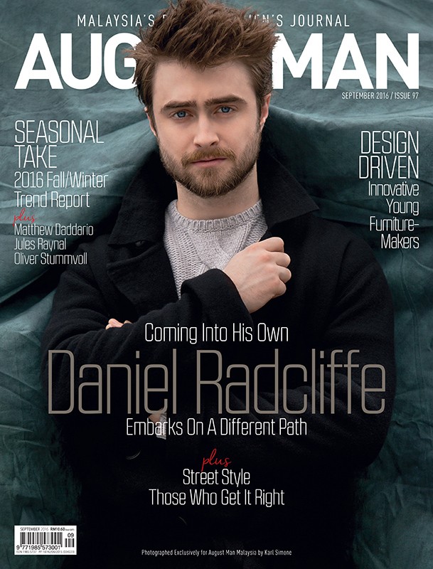Magazine cover featuring Daniel Radcliffe in a black coat and grey sweater. Text includes magazine title and cover story details.