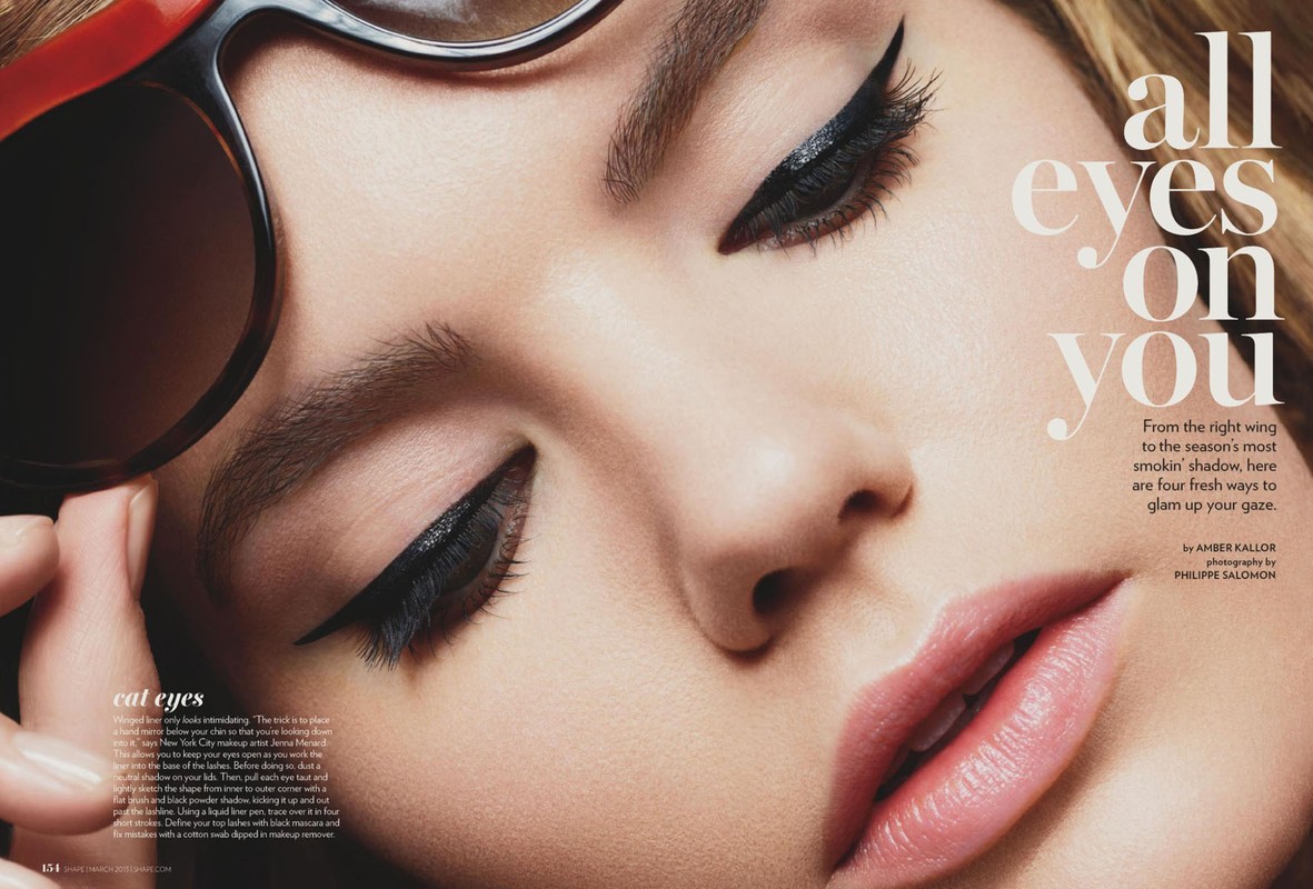 Close-up of a fair-skinned woman's face with winged eyeliner and glossy lips, framed by oversized sunglasses and text overlay.