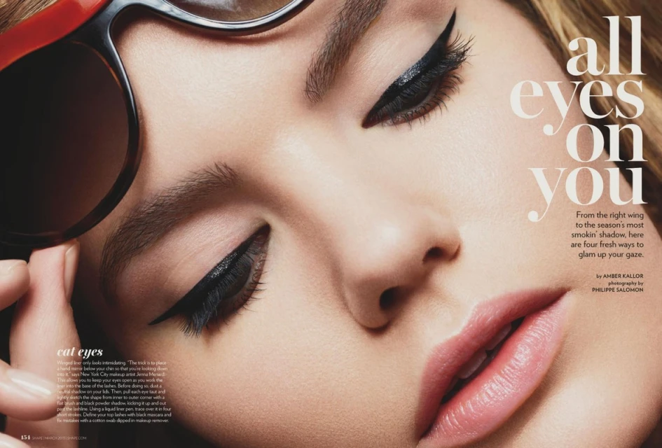 Close-up of a fair-skinned woman's face with winged eyeliner and glossy lips, framed by oversized sunglasses and text overlay.