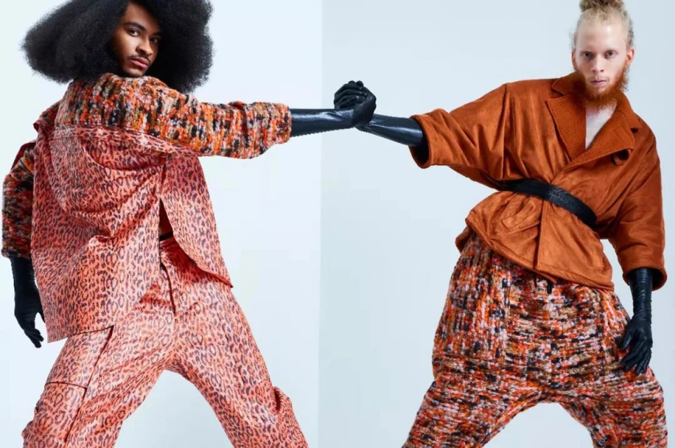Two fashion models pose in brightly patterned outfits in a studio setting, showcasing contemporary fashion with bold colors and unique styles.