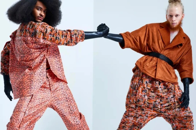 Two fashion models pose in brightly patterned outfits in a studio setting, showcasing contemporary fashion with bold colors and unique styles.
