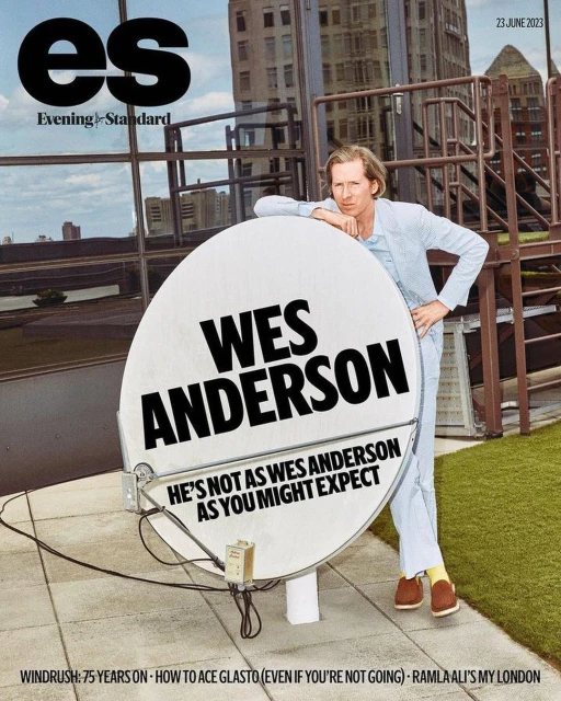 Evening Standard magazine cover featuring Wes Anderson leaning against a large satellite dish on a rooftop in front of city buildings.