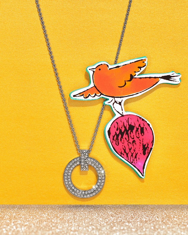 Elegant round diamond necklace on a delicate chain, artfully presented against a vibrant yellow backdrop with a playful bird illustration.