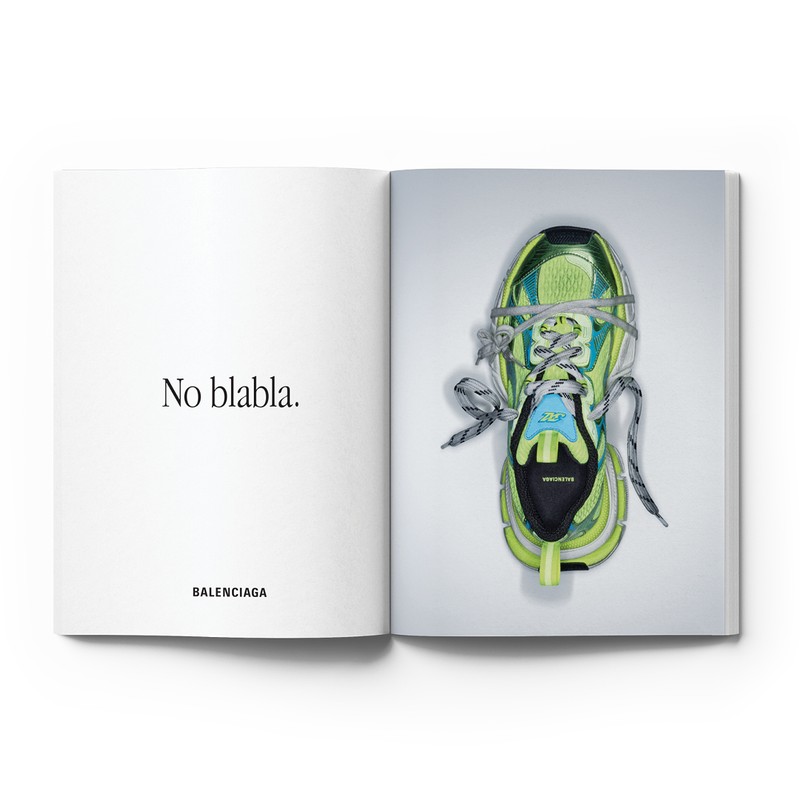 Open magazine showing typography on the left page and a green sneaker wrapped in string on the right page