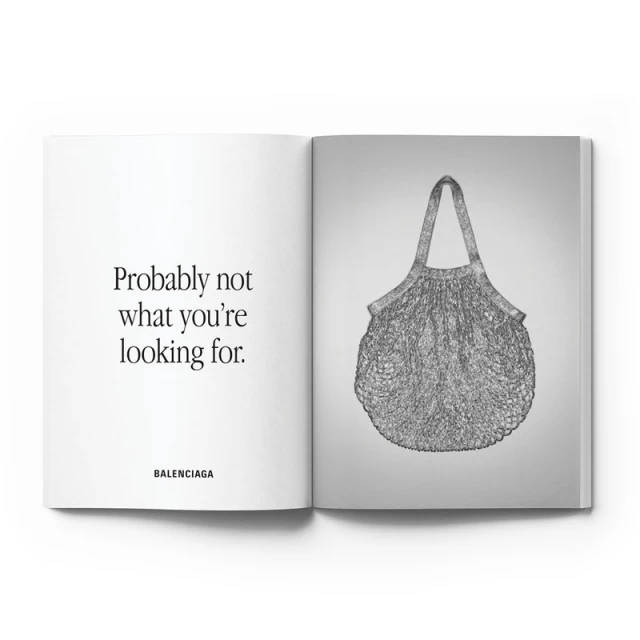 Open magazine spread with Balenciaga advertisement on one side and an image of a grey mesh tote bag on the other side.