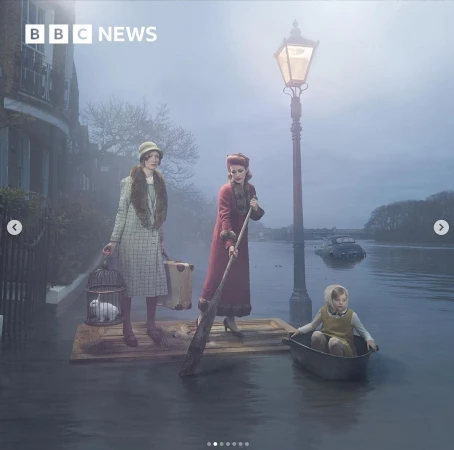 Three people in period clothing on water using a makeshift raft and rowboat, with foggy flooded street and buildings behind them.