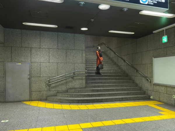 Woman in orange coat ascends subway stairs with yellow safety markings. Interior public transit station with grey tiled walls and lighting.