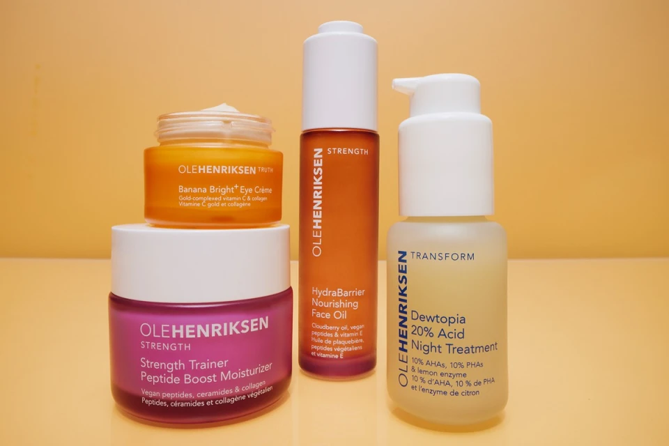 Olehenriksen skincare product set featuring eye creme, peptide boost moisturizer, nourishing face oil, and acid night treatment against yellow.